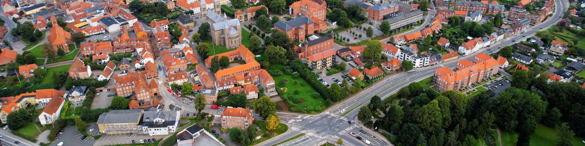 Aerial panorama of the old town of the city Viborg in Denmark on a cloudy summer morning.