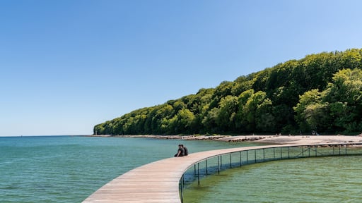 a couple enjoys a relaxing afternoon and the amazing views from the Infinite Bridge in Aarhus
