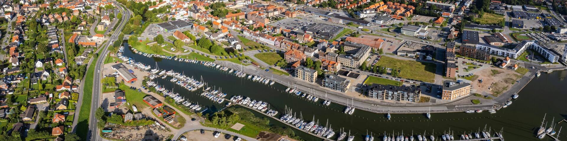Aerial panorama of the old town of the city Haderslev in Denmark on a sunny summer morning.