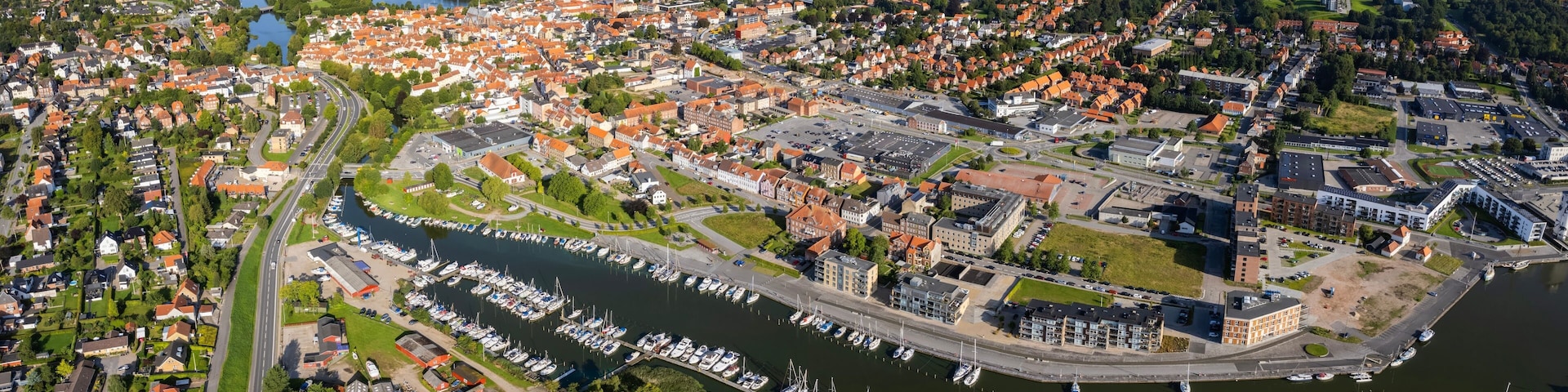 Aerial panorama of the old town of the city Haderslev in Denmark on a sunny summer morning.