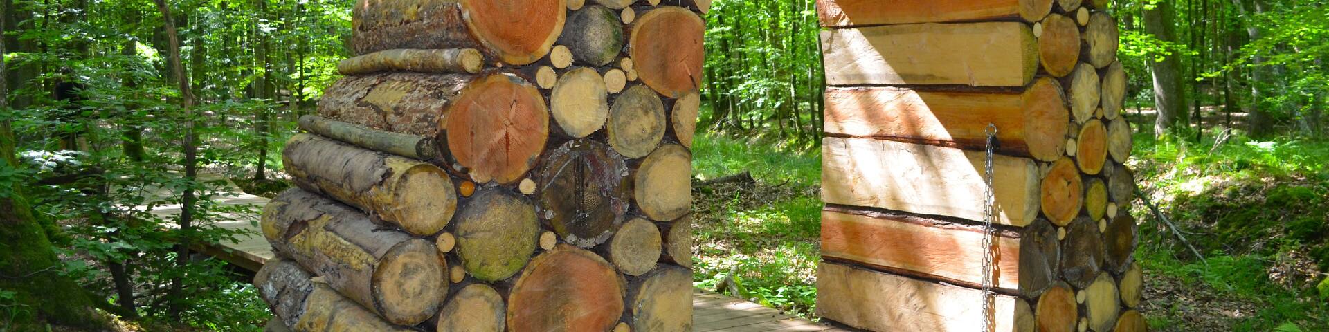 Wooden arch in a forest road in the forest of Gisselfeld Klosters. Denmark