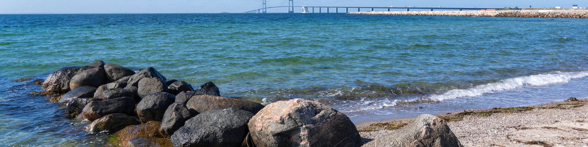 Panoramic view from Korsør to the East Bridge of Great Belt Fixed Link - Storebæltsbroen in Danish - a groyne in foreground´