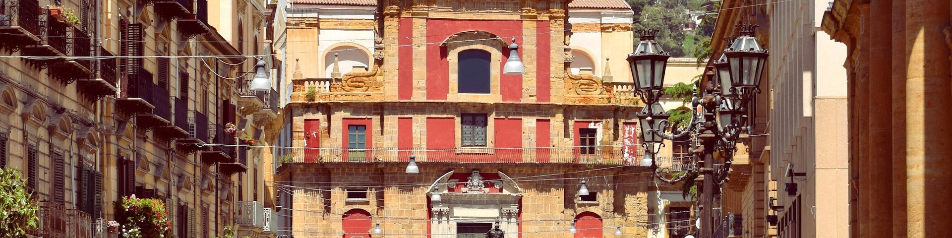 Facade of the church of Sant'Agata ("Saint Agatha") al Collegio and partly view of Corso Umberto I in Caltanissetta, Italy