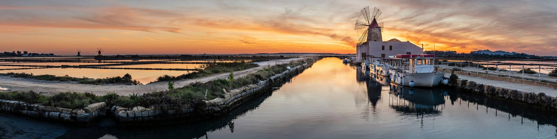 windmill in the salt flats at sunset, Stagnone Nature Reserve, Marsala , Trapani, Sicily, Italy, Europe