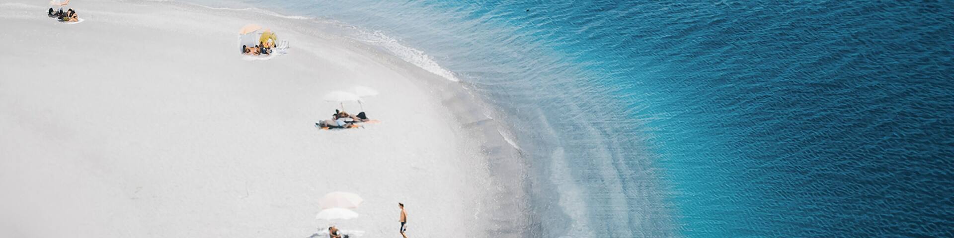 Aerial view of people at beach, Marinello Lakes, Sicily, italy.