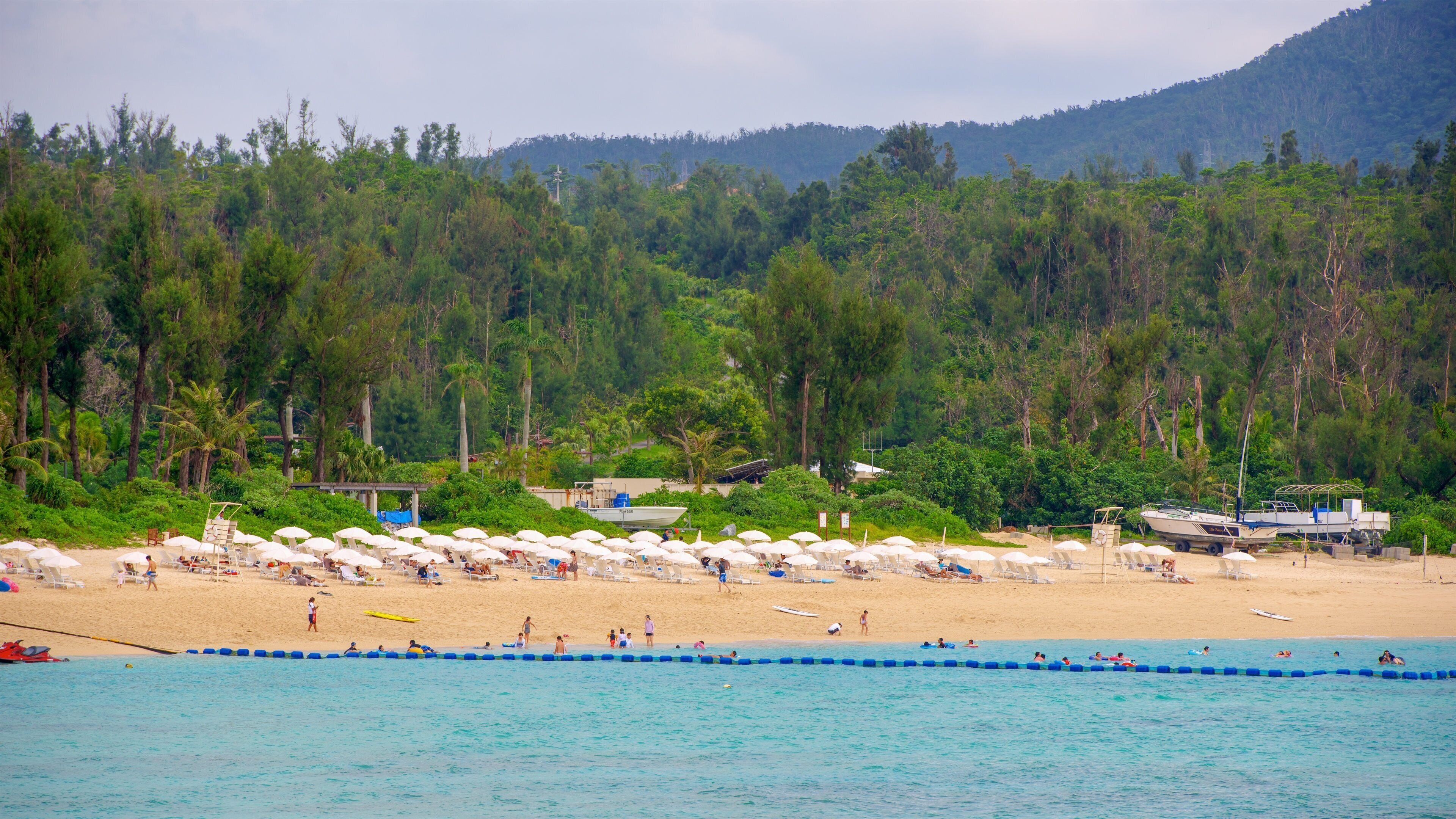 Nago which includes a sandy beach and general coastal views