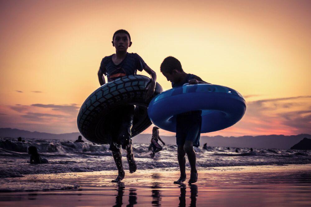 Kids playing by the beach at Kino Bay
