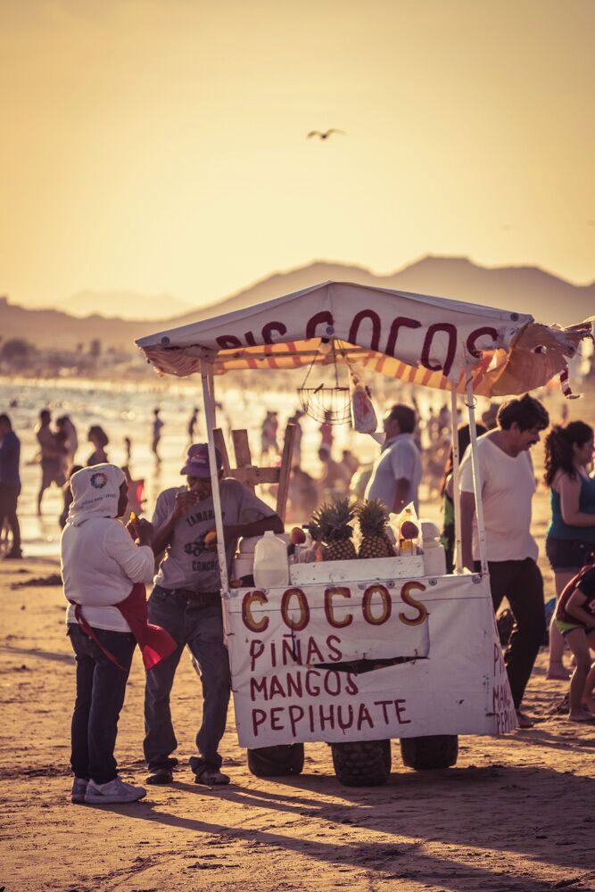 Mariscocos stand: selling coconuts stuffed with seafood on the beach
