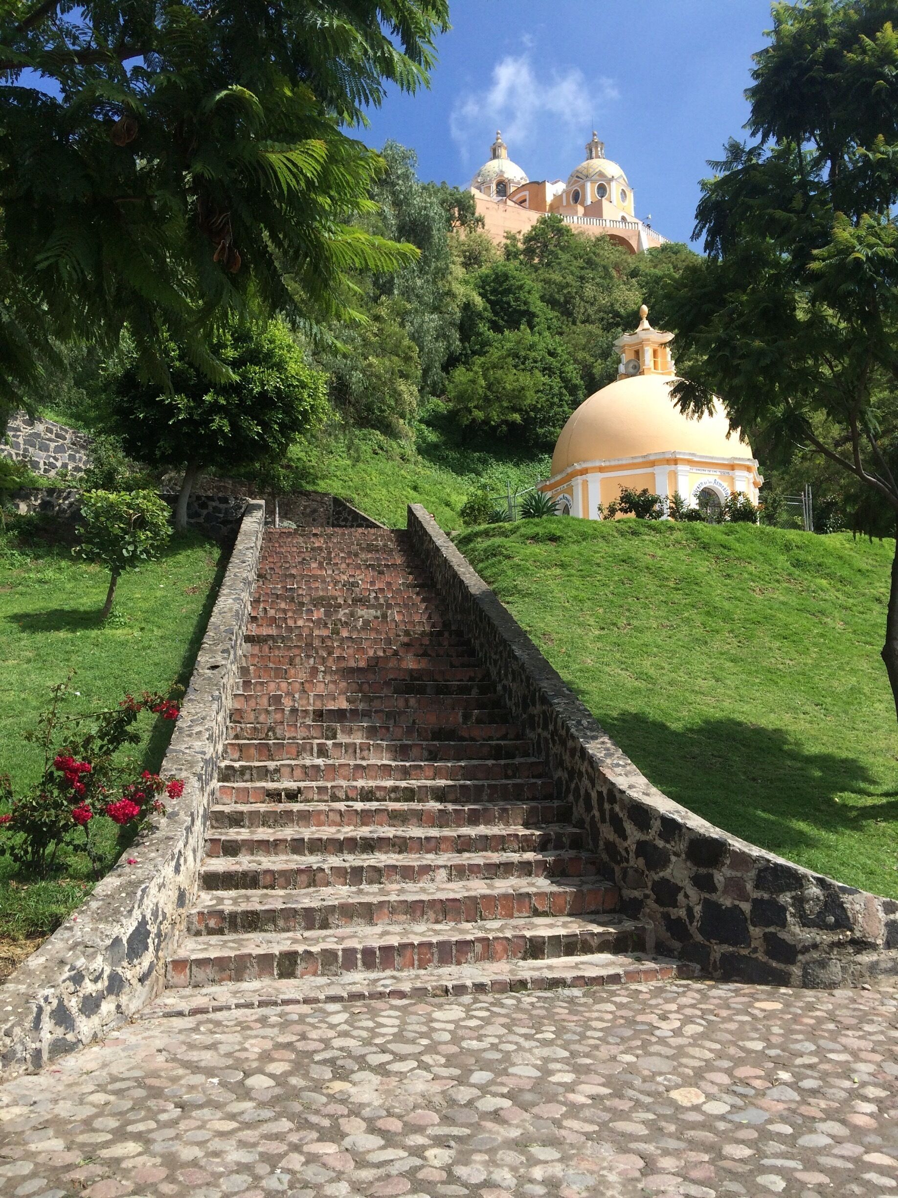 Garden and courtyard outside of the large Catholic Church on the Great Pyramid ruins.
