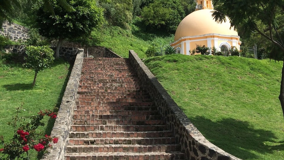 Garden and courtyard outside of the large Catholic Church on the Great Pyramid ruins.