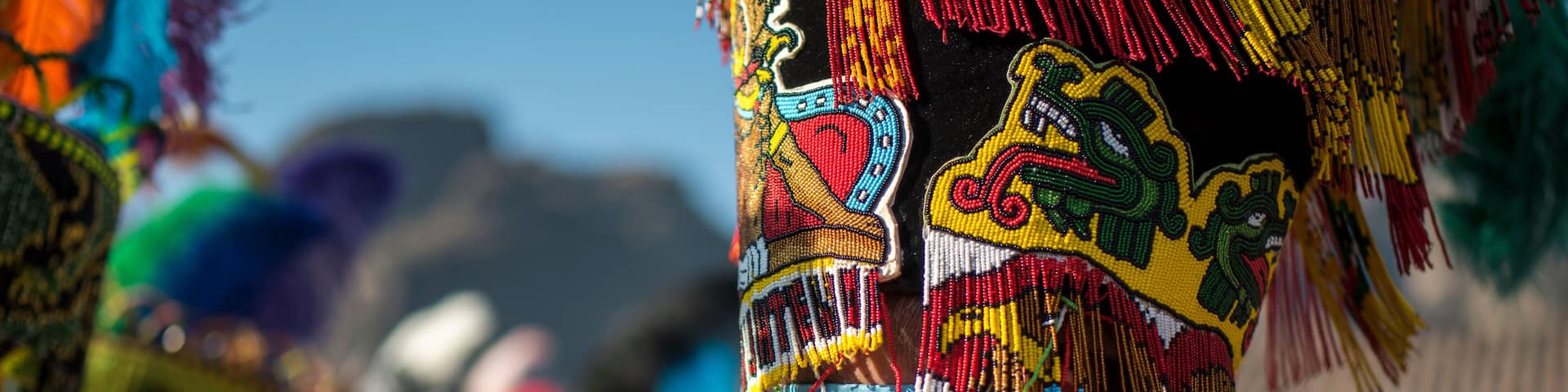 Chinelo or Chinelos are a traditional colorful costumed dancer in carnaval, is popular in the Mexican state of Morelos near Tepoztlan , State of Mexico and Mexico City, Milpa Alta and Xochimilco.
