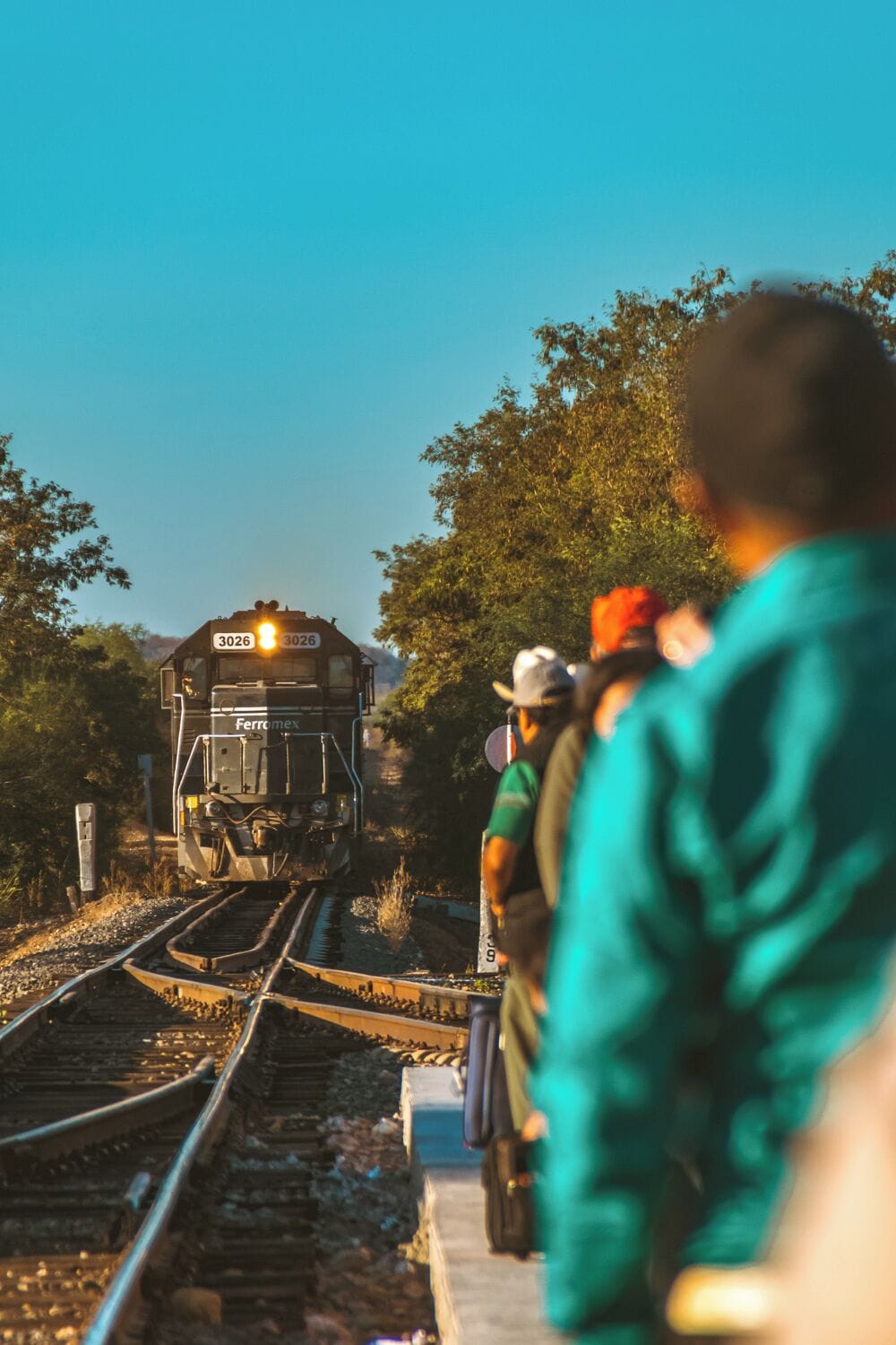 People standing in line as El Chepe—the only passenger train in Mexico—arrives to El Fuerte, Sinaloa.