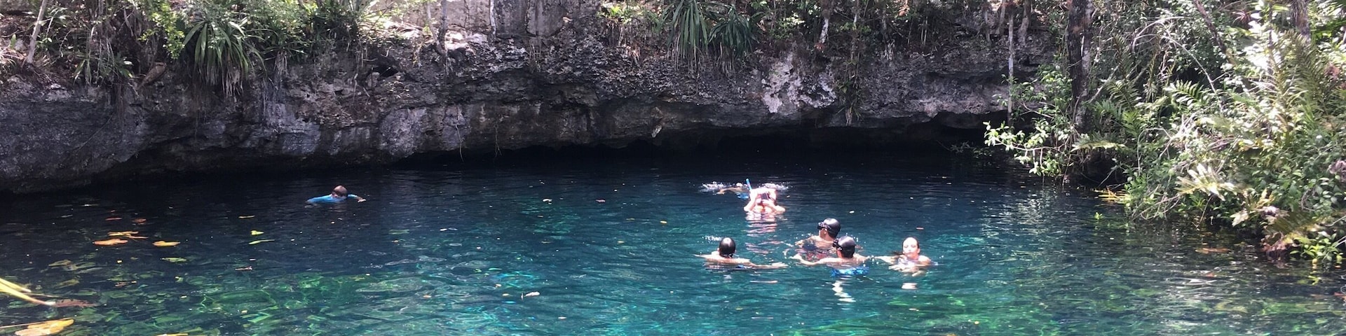 cliff jumping into this beautiful cenote