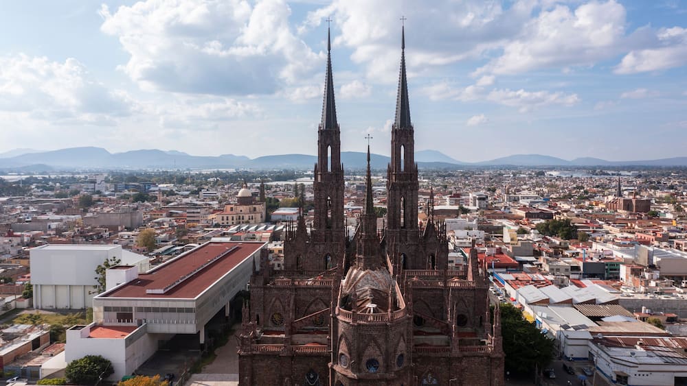 Zamora, Michoacán, Mexico - December 24, 2023: Afternoon light shines on a historic church in the heart of downtown Zamora.