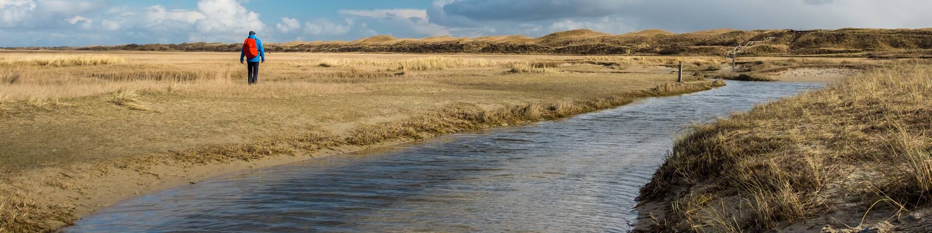 Lone hiker in De Slufter, a nature reserve in Texel, on Tuesday 28 February 2017, Texel, the Netherlands.