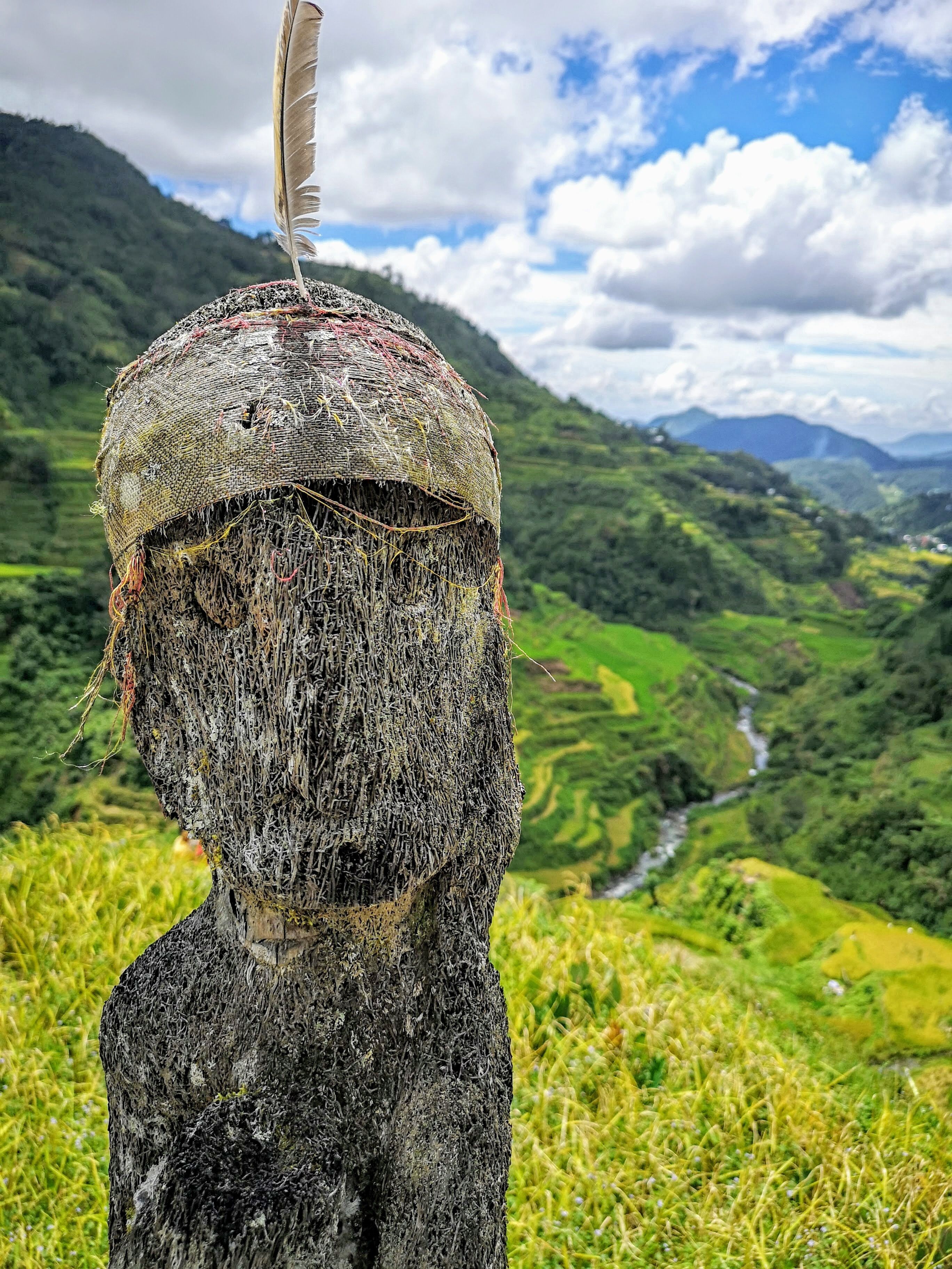 Found this "Bulul or Bul-ul" standing guard over some rice terraces in the Cordillera, Mountain Province. The Ifugaos believe that the spirit of the rice god resides inside these sculptures.

A "mumbaki" or shaman performs rituals to invoke the spirit of the rice god to guard and protect the rice terraces and the granaries to ensure an abundant harvest and invoke protection against any catastrophe. #ItsMoreFunInThePhilippines