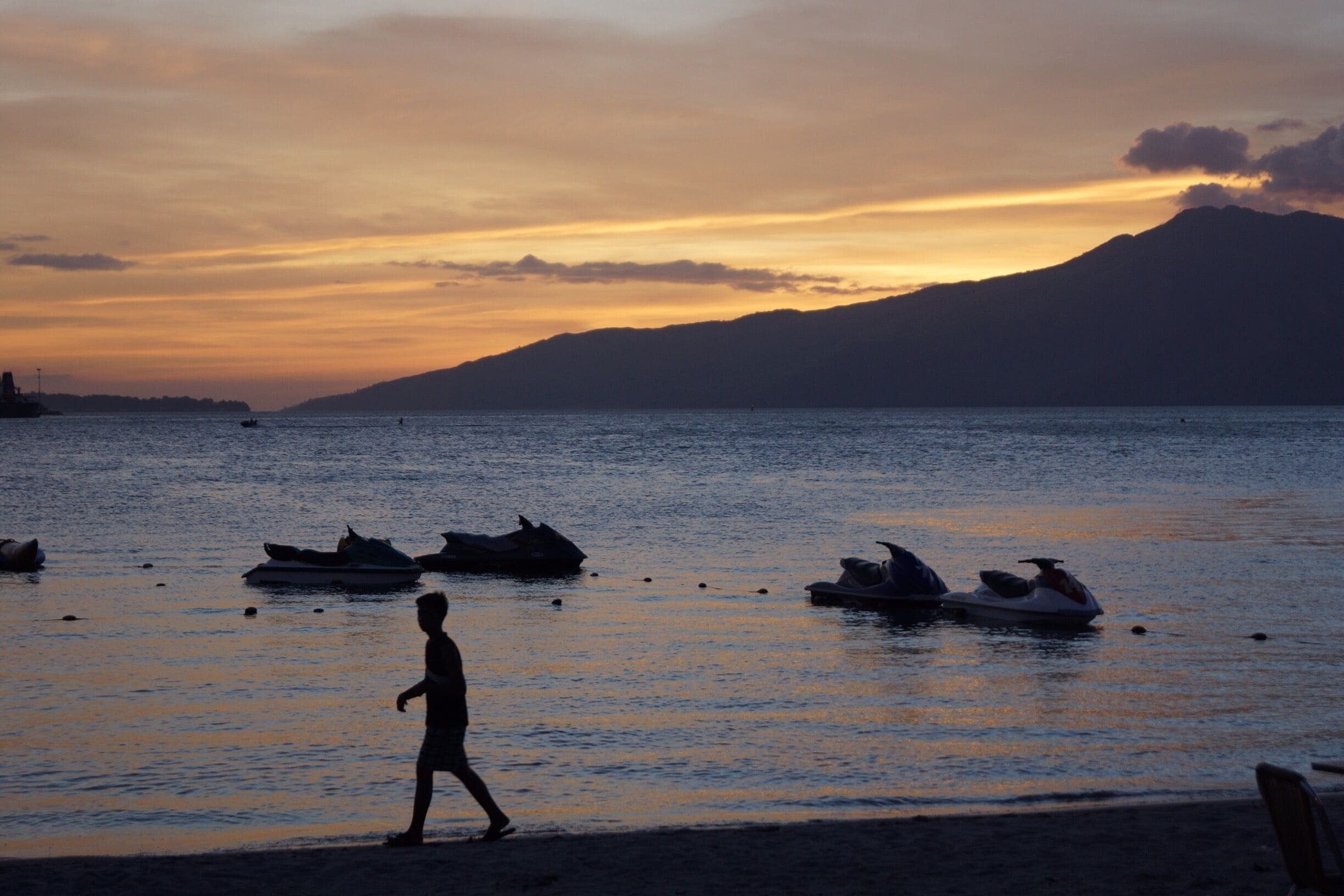 Beautiful sunset 
Captured this young person walking along the beach 