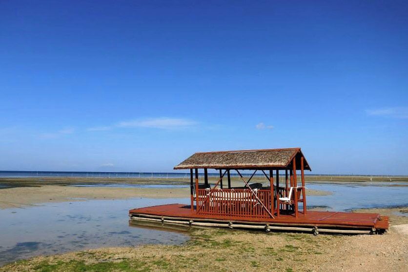 The raft was parked on the shore when I took this photo. It was still low tide at that time. The raft may look fragile but it can hold around 30 people without sinking. This is where my friends and I all hang out when we're not doing water activities.