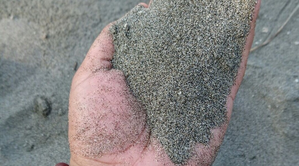 Powdery black sand. Too bad, mobile can't capture the sparks.
