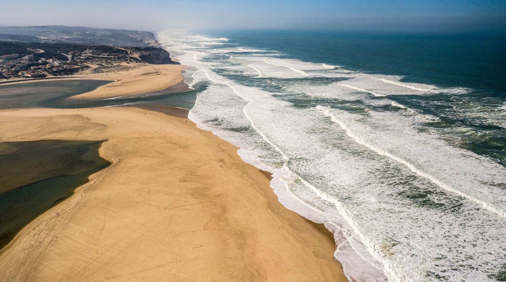 Foz do Arelho Beach, in Caldas da Rainha, Portugal. Sea and sandy landscape with fog. Aerial View
