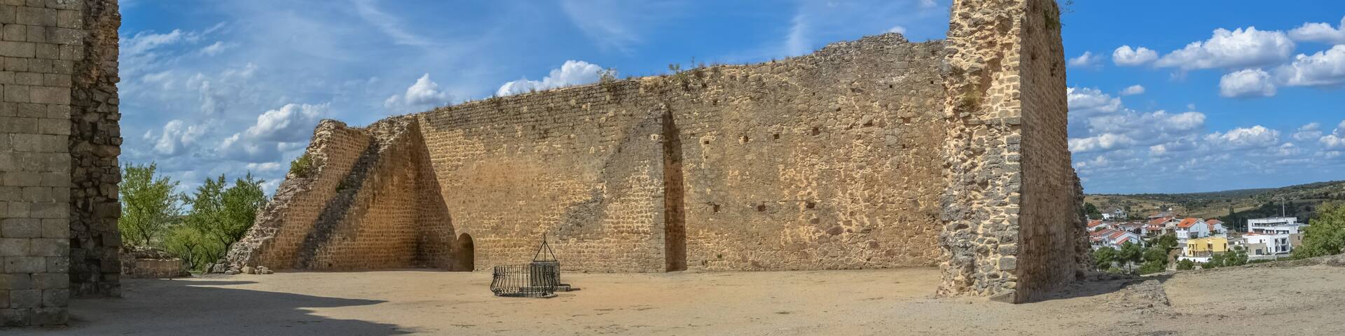 View at the Medieval fortress walls ruins and garden on medieval downtown city, in Miranda do Douro