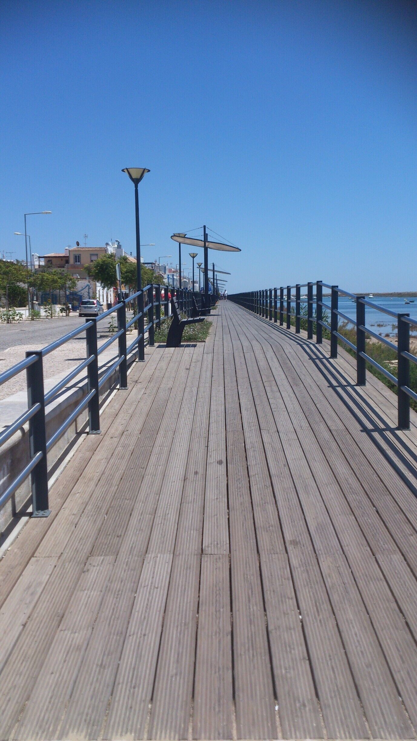 I recommend a walk along the boardwalk with a stop for an icecream from one of the café shops on the street, but take a seat on one of the benches not the café an enjoy the view over the Ria Formosa #NationalPark wetlands. 
From here get a boat/water taxi across the river to the beach Ilha de Cabanas for a spot of sunbathing or birdwatching as rare birds come to the wetlands to breed.
