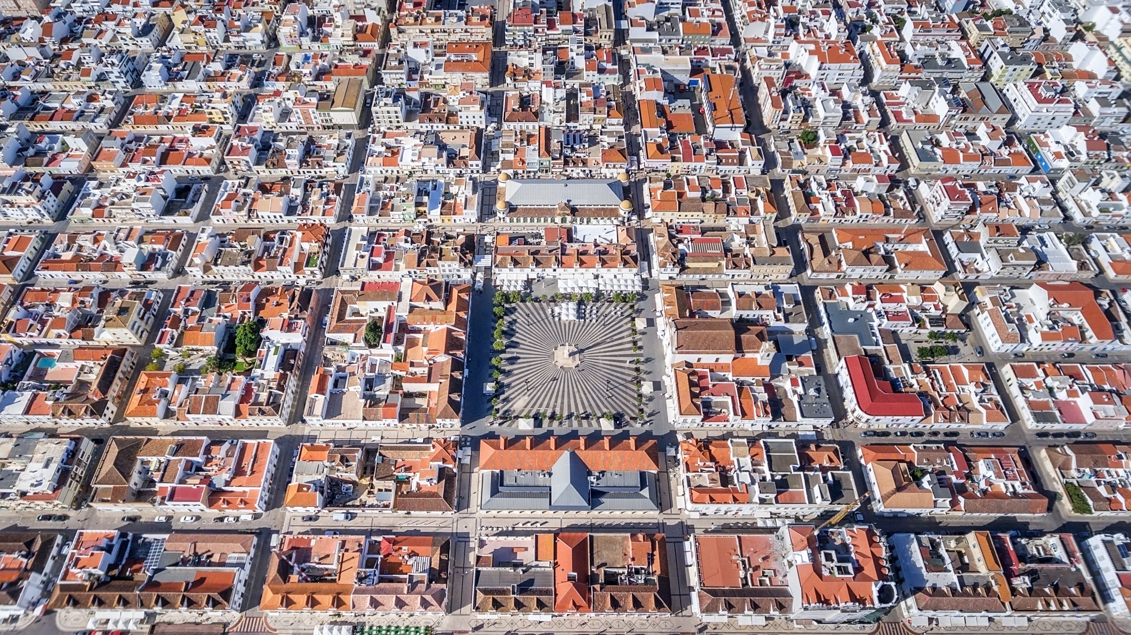 Aerial. Geometric shapes of the village Vila Real Santo Antonio from sky