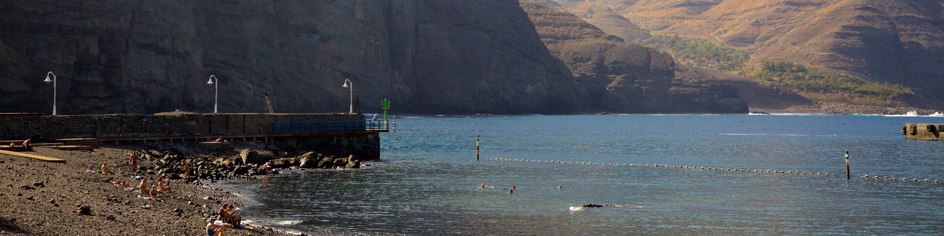 Agaete which includes general coastal views, mountains and rugged coastline