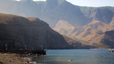 Agaete which includes general coastal views, mountains and rugged coastline