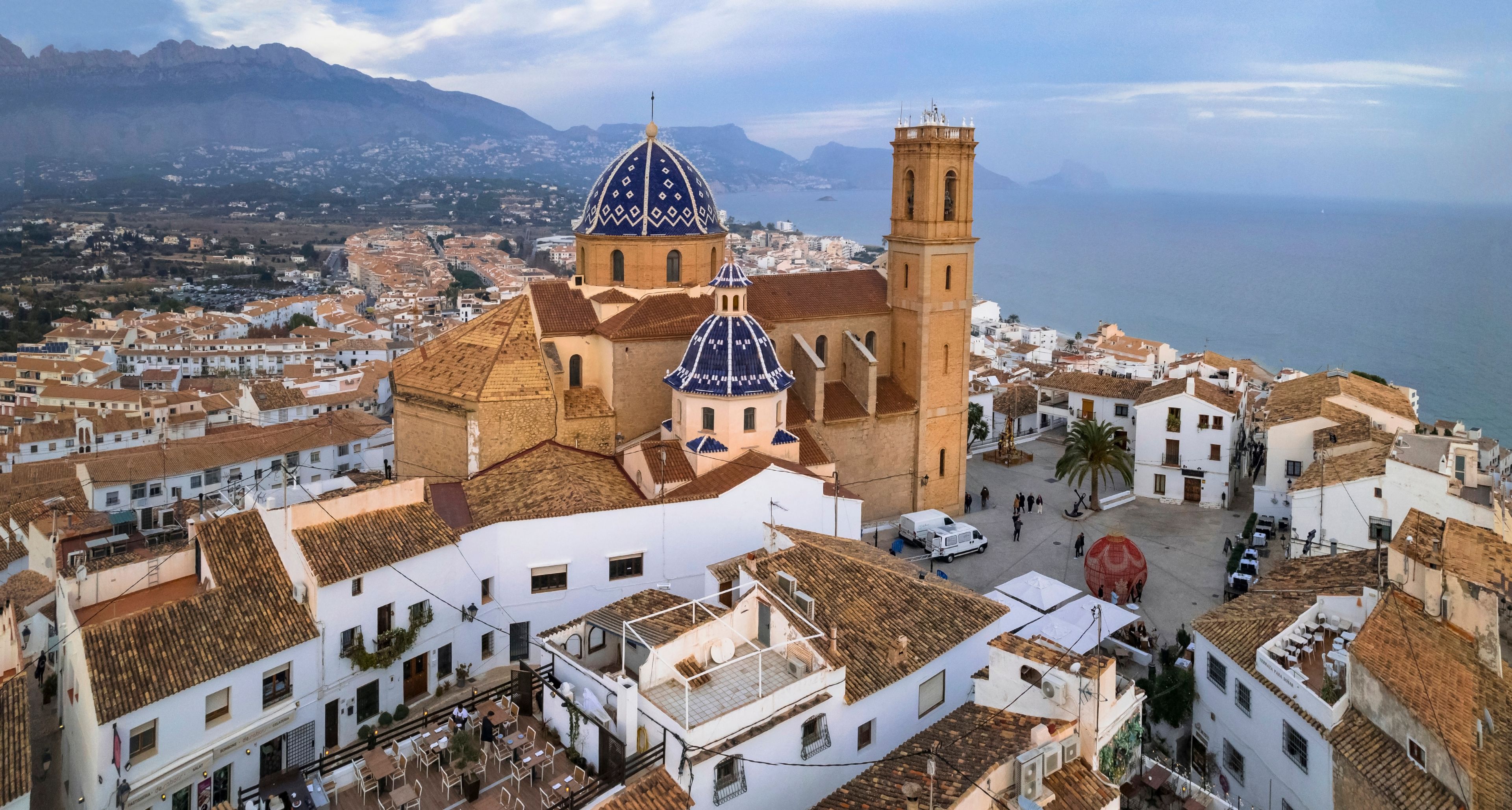 Altea Spain drone panorama of blue dome Consuelo cathedral. World print wide aerial view of historic white old town houses on Costa Blanca Alicante Mediterranean coast