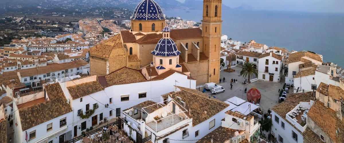 Altea Spain drone panorama of blue dome Consuelo cathedral. World print wide aerial view of historic white old town houses on Costa Blanca Alicante Mediterranean coast
