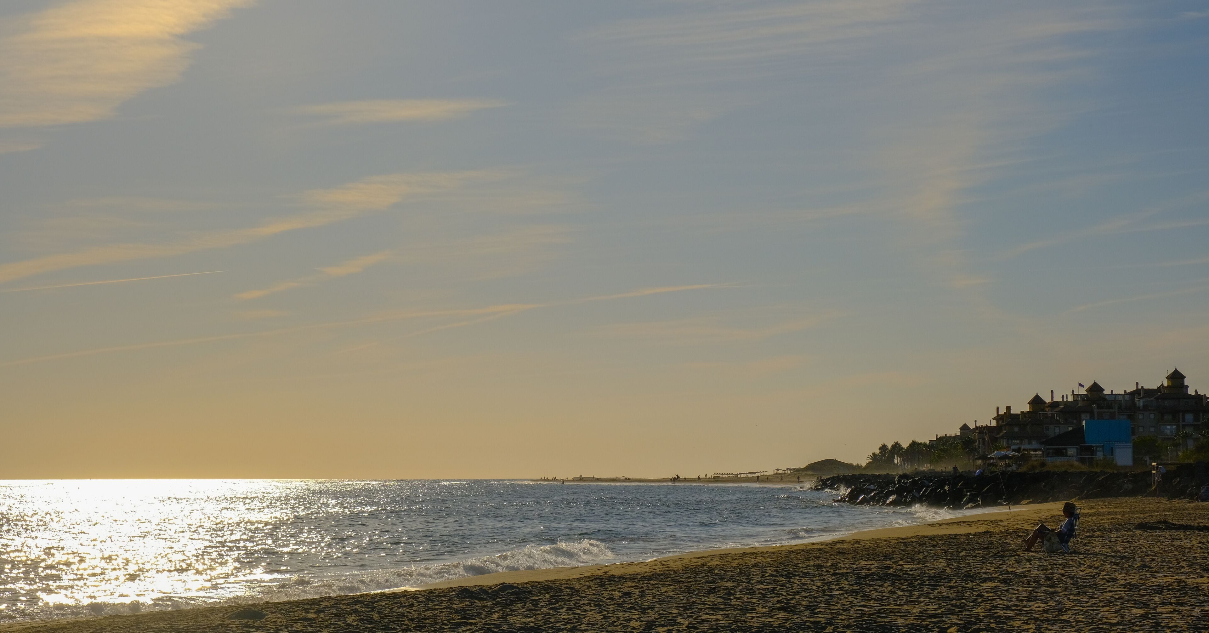 Person relaxing on the beach at Canela Island Ayamonte in Andalusia, Spain