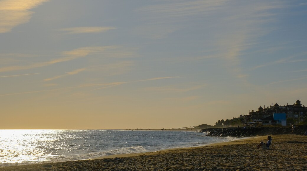 Person relaxing on the beach at Canela Island Ayamonte in Andalusia, Spain