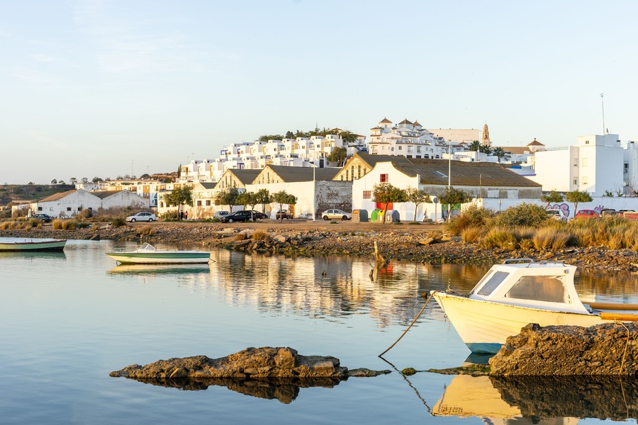 Ayamonte cityscape with fishermen's boats on Guadiana river, Andalusia, Spain