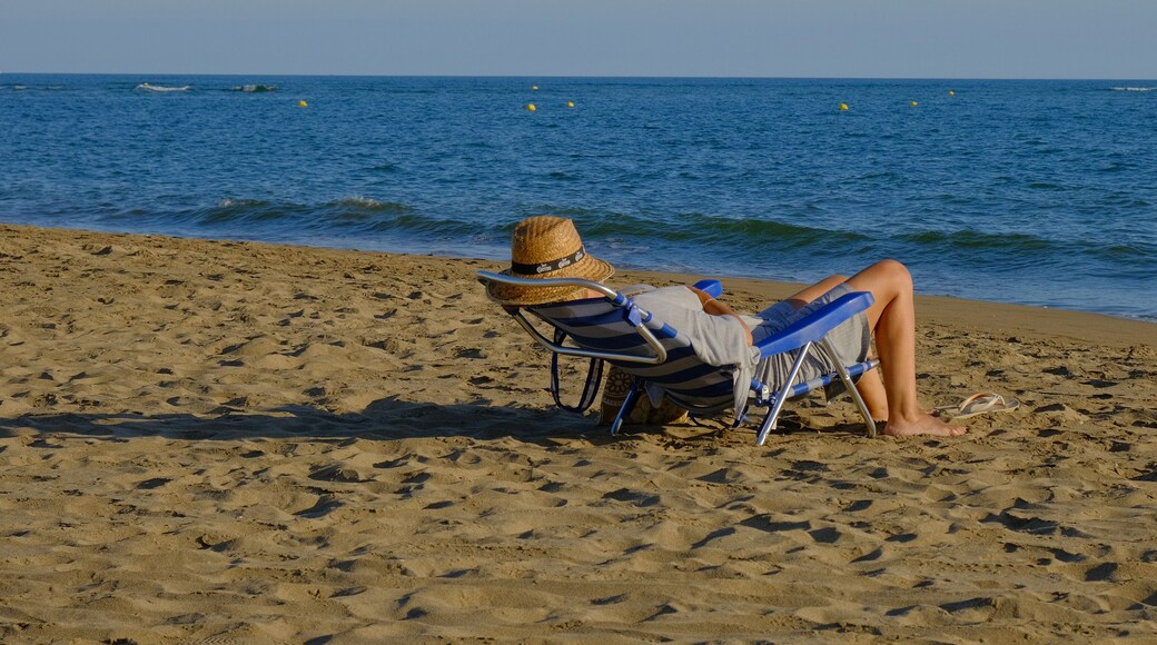 Man relaxing on the beach at Canela Island Ayamonte in Andalusia, Spain