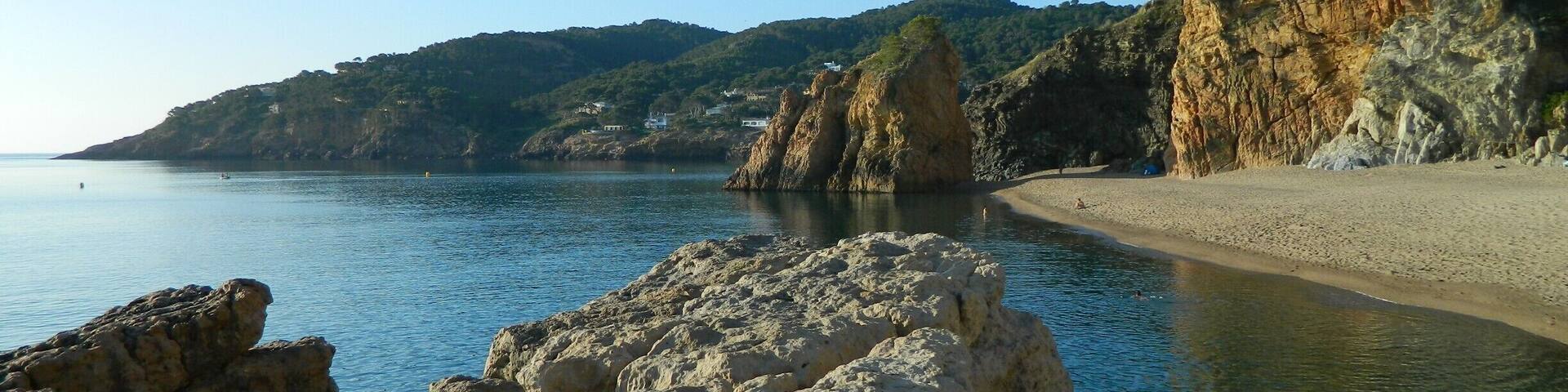 This was one of my favorite spots in Spain. It has clear blueish-green water and was great for swimming and jumping off the rock in front. There is a small cave in the far back corner on the beach which has many mosquito's at night (bummer). This photo was taking in the morning before it got over populated with naked Spaniards swimming and playing ping pong on the beach. I would come here again I had a great time and camped 2 nights on the beach. The location of the beach is the closest I can do but it is referred by the locals as (Platjanudista).#Beach