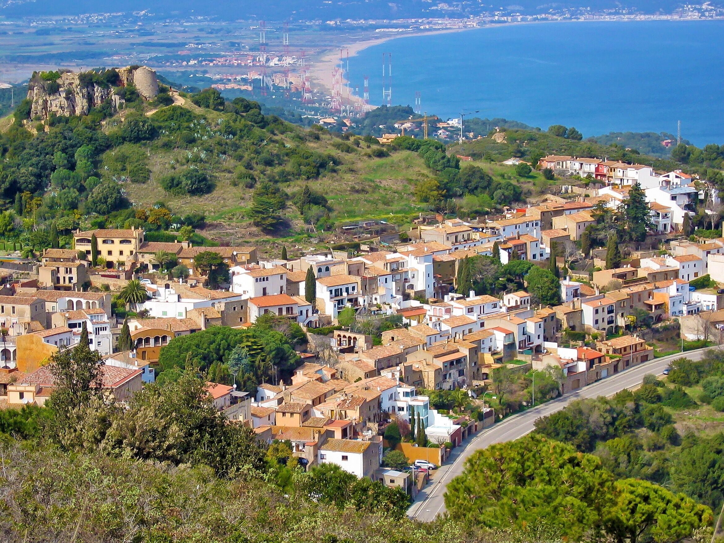 Aerial view of Begur village with the Mediterranean sea in background, Costa Brava, Spain