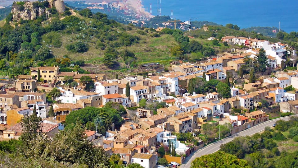 Aerial view of Begur village with the Mediterranean sea in background, Costa Brava, Spain
