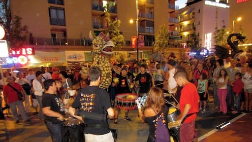 I have no idea what this street festival is called, it happened in July sometime, but I can say that these events happen all summer long in the streets of Calella, and many Spanish cities. You can't necessary expect them or plan for them, which adds to the fun of the surprise when one pops up on you.
At this particular event drum circles came barreling down the promenade with people pushing these unusual parade-float like costumes of chickens and dragons. Once we reached the end of the promenade the chickens and dragons were lit on fire and danced in the street, no one was injured (too terribly, some sparks ruined on-lookers clothing and left a few small burns, nothing to cry about. I mean it is Spain after all, anything for a good party).