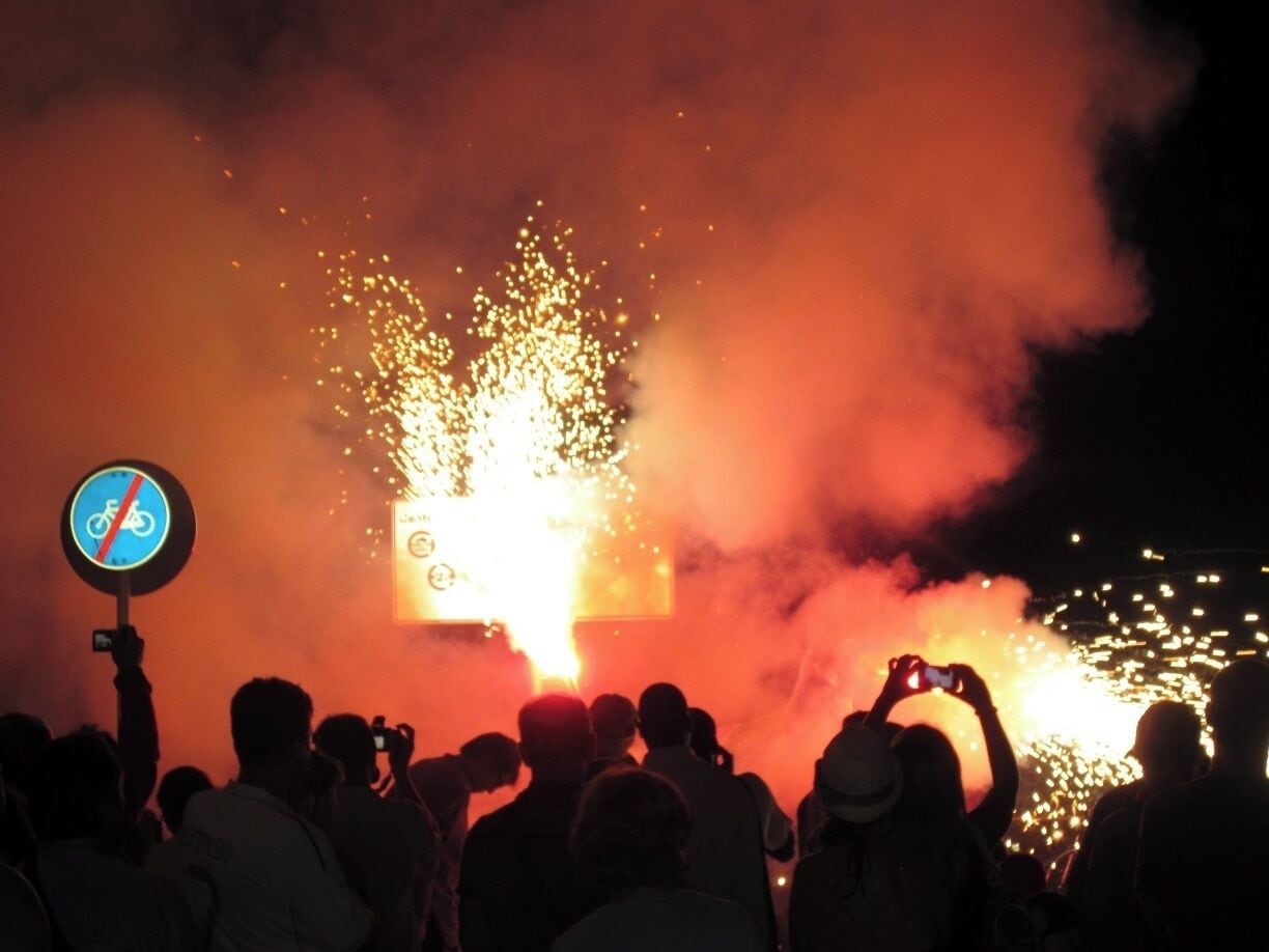 See, I definitely was not embellishing...

I have no idea what this street festival is called, it happened in July sometime, but I can say that these events happen all summer long in the streets of Calella, and many Spanish cities. You can't necessary expect them or plan for them, which adds to the fun of the surprise when one pops up on you.

At this particular event drum circles came barreling down the promenade with people pushing these unusual parade-float like costumes of chickens and dragons. Once we reached the end of the promenade the chickens and dragons were lit on fire and danced in the street, no one was injured (too terribly, some sparks ruined on-lookers clothing and left a few small burns, nothing to cry about. I mean it is Spain after all, anything for a good party).