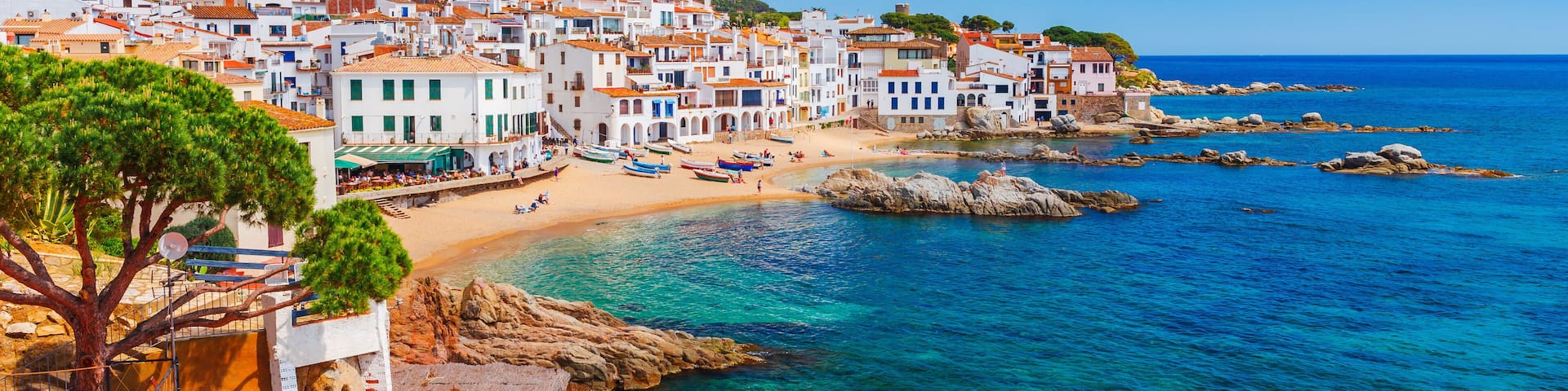 Sea landscape with Calella de Palafrugell, Catalonia, Spain near of Barcelona. Scenic fisherman village with nice sand beach and clear blue water in nice bay. Famous tourist destination in Costa Brava