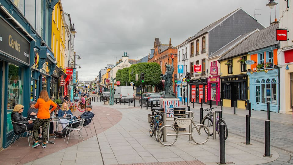 Killarney featuring outdoor eating as well as a small group of people