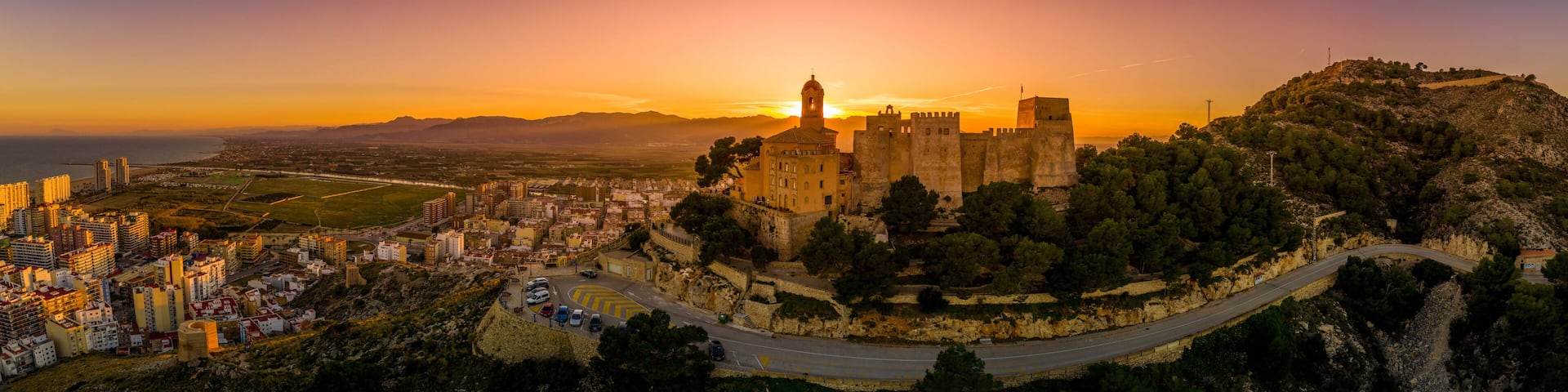 Cullera castle and church on a hilltop overlooking the popular summer resort town and the Mediterranean in Spain
