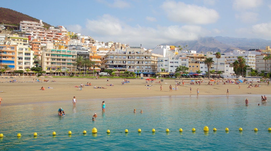 Los Cristianos featuring swimming, general coastal views and a sandy beach