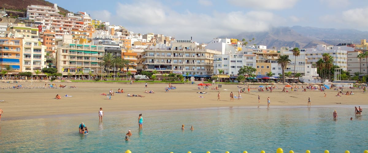 Los Cristianos featuring swimming, general coastal views and a sandy beach