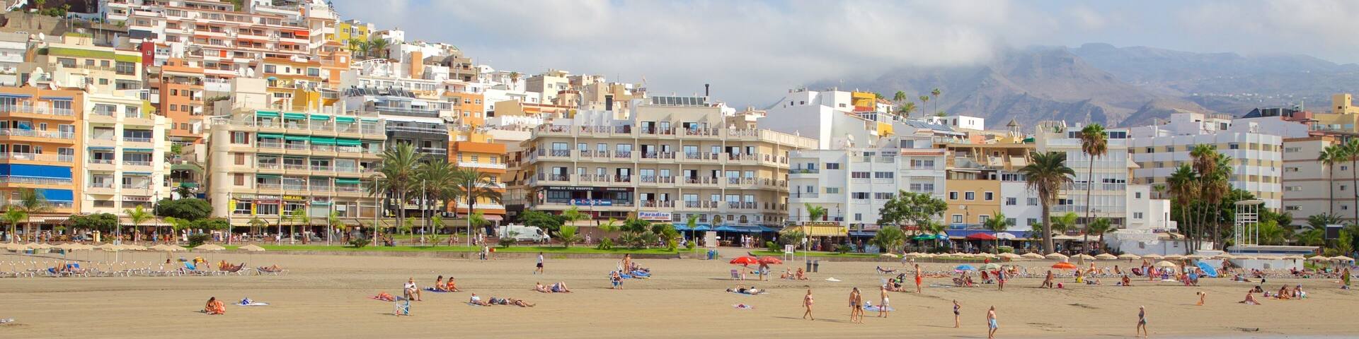 Los Cristianos featuring swimming, general coastal views and a sandy beach