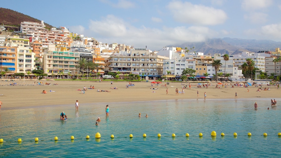 Los Cristianos featuring swimming, general coastal views and a sandy beach
