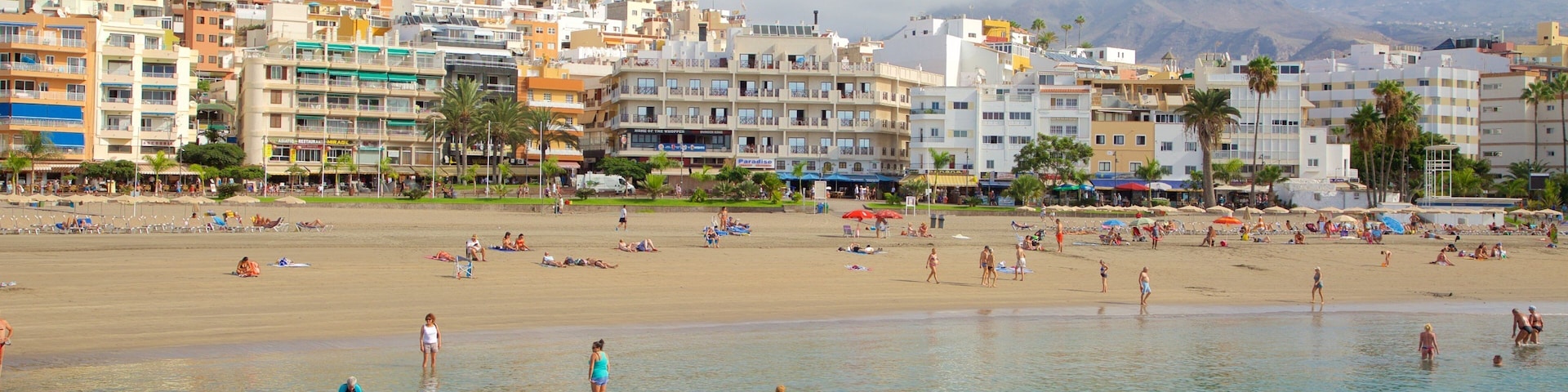 Los Cristianos featuring swimming, general coastal views and a sandy beach
