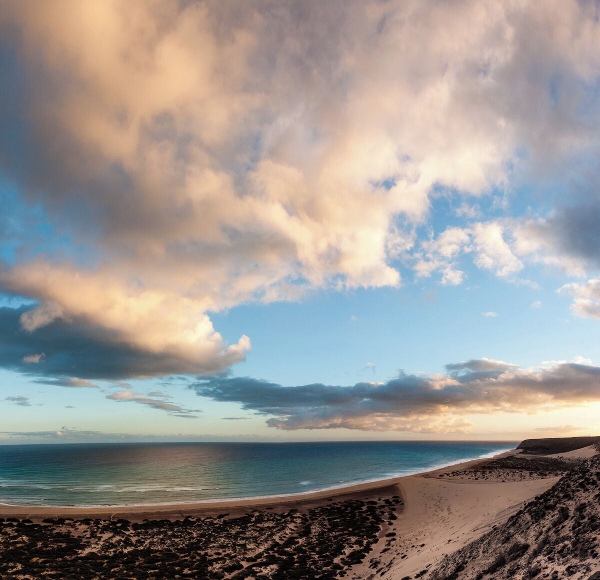 From the top of the big dune you have an amazing view to the beach and ocean. Actually IMHO it's a better sunrise than sunset spot, even though I took this picture at sunset...