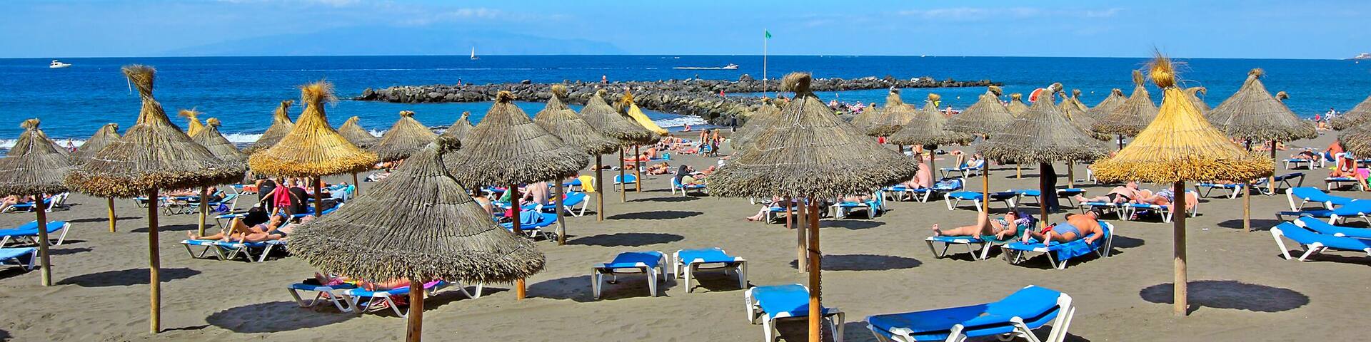 Beach in the tourist resort Playa de las Americas, Tenerife island, Canary Islands, Spain
